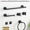 A set of black bathroom hooks and a towel ring displayed on a white wall.