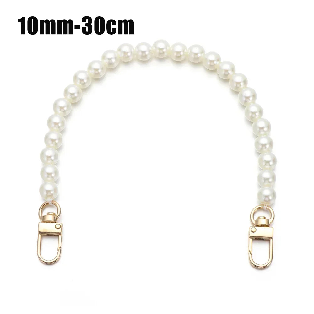 A strand of white pearls used as a chain strap for bags or purses.