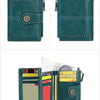 A teal leather wallet with multiple card slots and a decorative stitching detail.