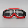 A pair of red and black retro foldable motorcycle goggles with a clear lens.