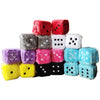 A collection of colorful plush velvet dice in various colors including red, gray, pink, white, and blue.