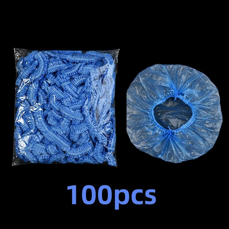 A package of 100 disposable blue shower caps for hair protection and salon use.