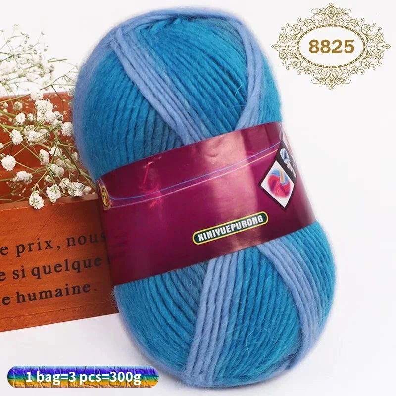 A skein of bright blue and light blue gradient dyed wool blend yarn for knitting