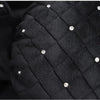 Black quilted car neck pillow featuring rhinestone detailing.