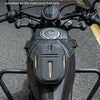 A black motorcycle hip pack is mounted on a bike, showing magnets designed to be adsorbed onto the fuel tank.