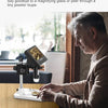 A man is using a 4.3 inch LCD digital microscope with 1000x magnification to inspect a piece of jewelry.