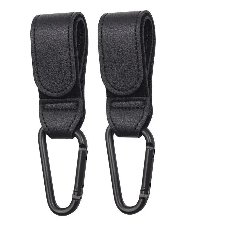 A pair of black PU leather stroller hooks with swivel bags for organizing strollers and prams.