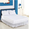 White Jacquard lace bed skirt with elastic band and 15 inch drop displayed on a bed.