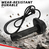 Black electric bike throttle grip with a coiled cable lying on a rough surface.