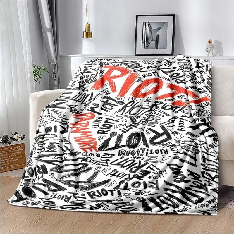 A black and white fleece throw blanket featuring the My Chemical Romance band name written in red text.