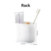 A white rack organizer holding a toothbrush and a small rectangular item.