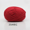 A ball of bright red 4-ply milk cotton yarn for knitting and crochet.