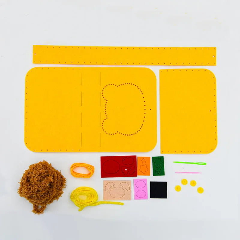 A yellow felt animal sewing craft kit with various colored felt shapes and tools.