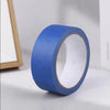 A roll of blue masking tape with a white core shown from the side.
