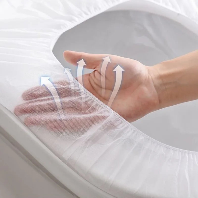 A hand is shown placing a disposable toilet seat cover onto a toilet, demonstrating the product's fit.