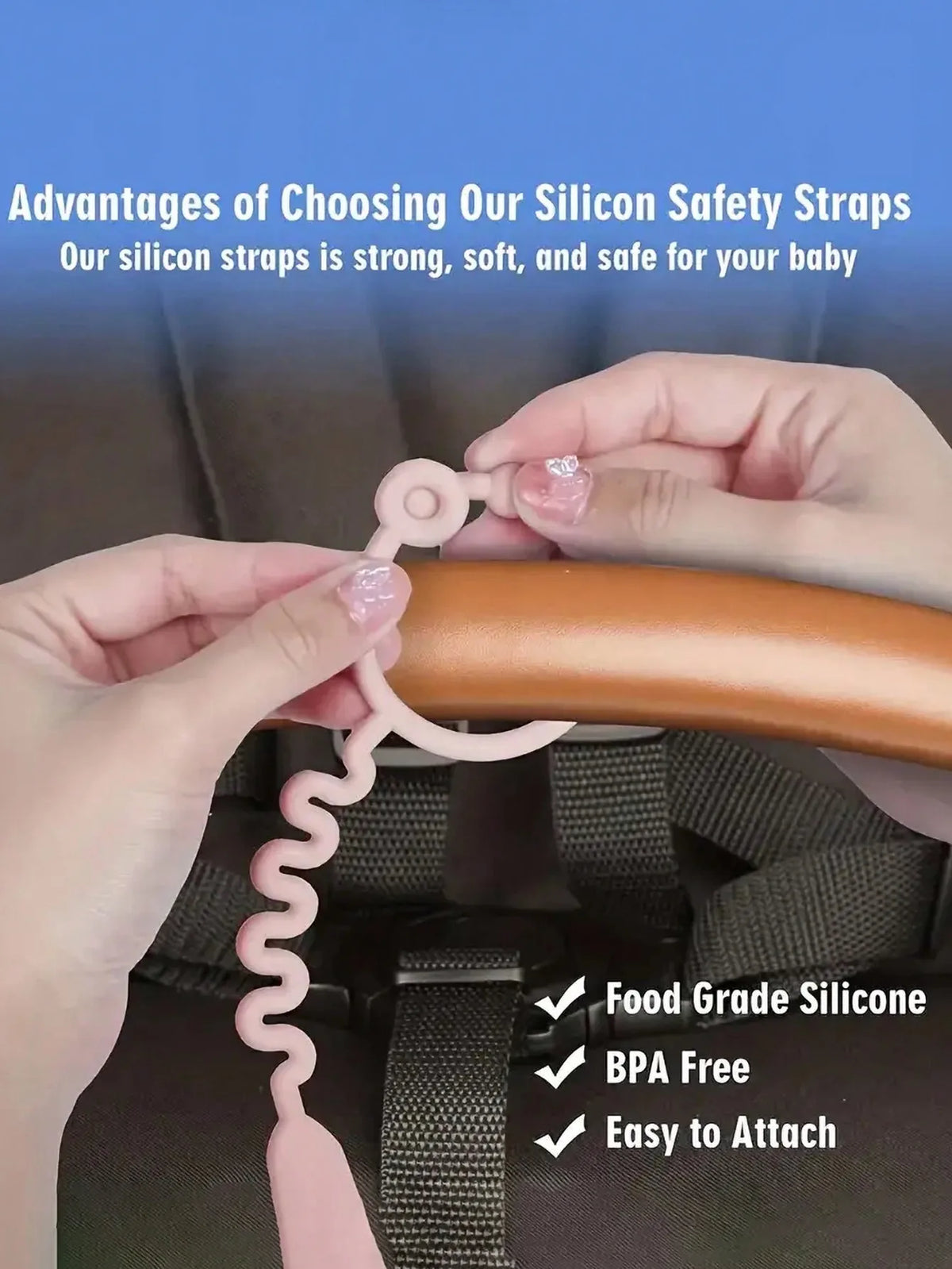Hands are attaching a silicone safety strap to a baby's pacifier clip on a dark fabric.