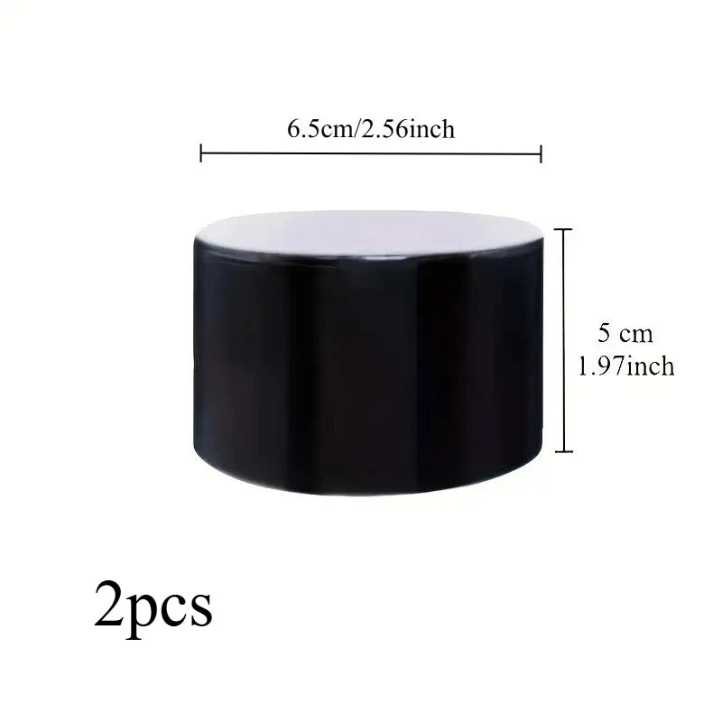 Zwei schwarze zylindrische Dichtbandrollen, 5 cm lang, mit einer Länge von 6,5 cm.