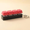 A black LED mechanical keychain fidget toy with pink and red custom keycaps.