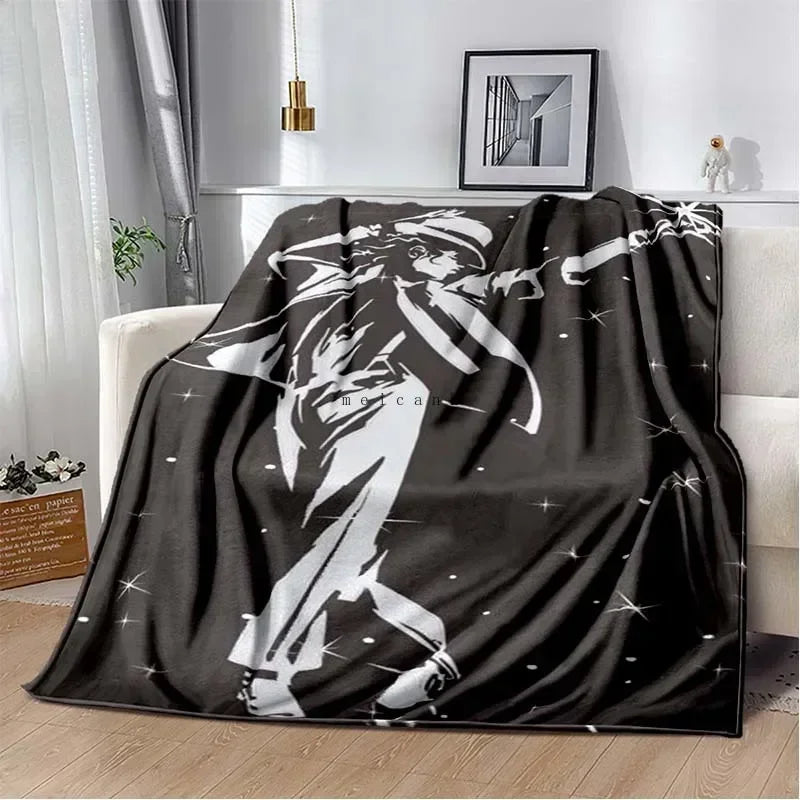 A black and white print of Michael Jackson running on a flannel throw blanket.