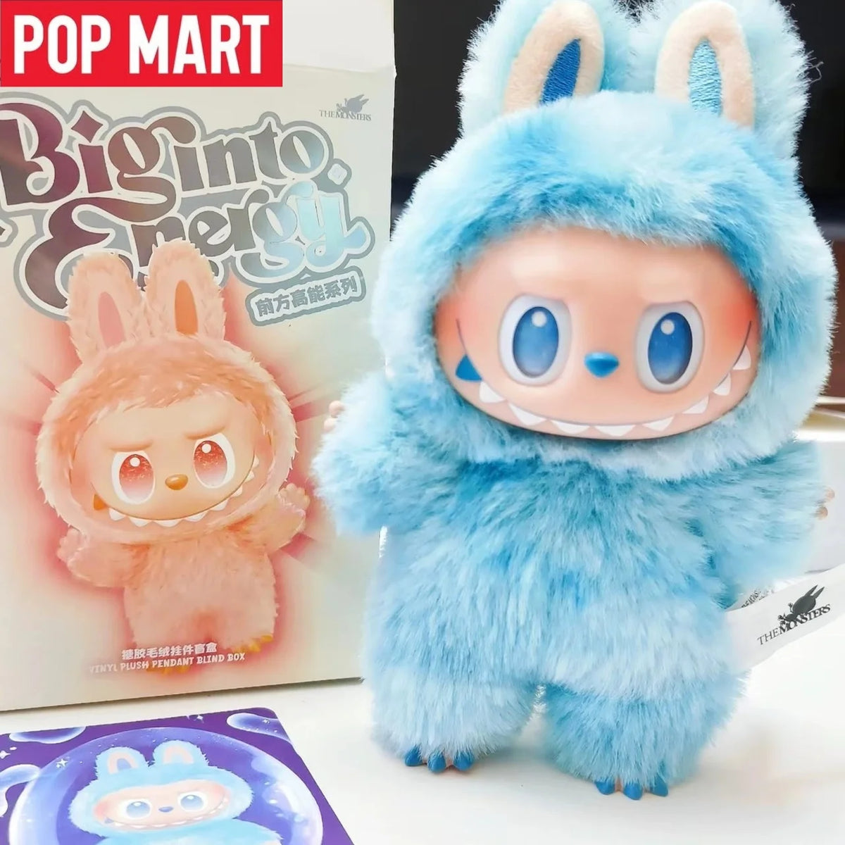 A fluffy blue Labubu Big Into Energy plush doll with large ears and a smiling face.
