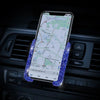 A smartphone displaying a map is held in a car vent phone holder with blue LED lights.
