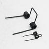 A set of black double torsion springs used for DIY projects and repairs.