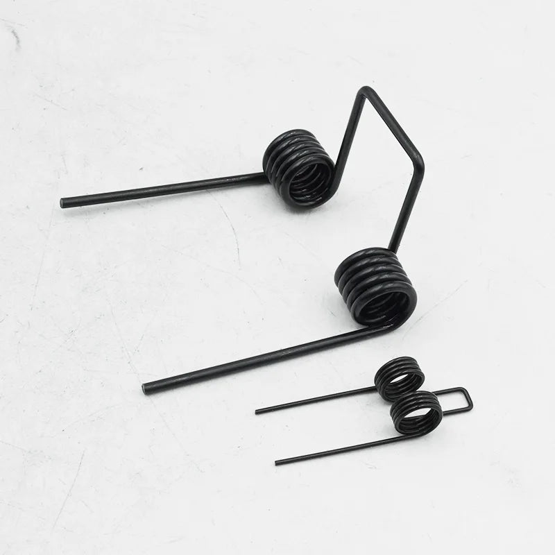 A set of black double torsion springs used for DIY projects and repairs.