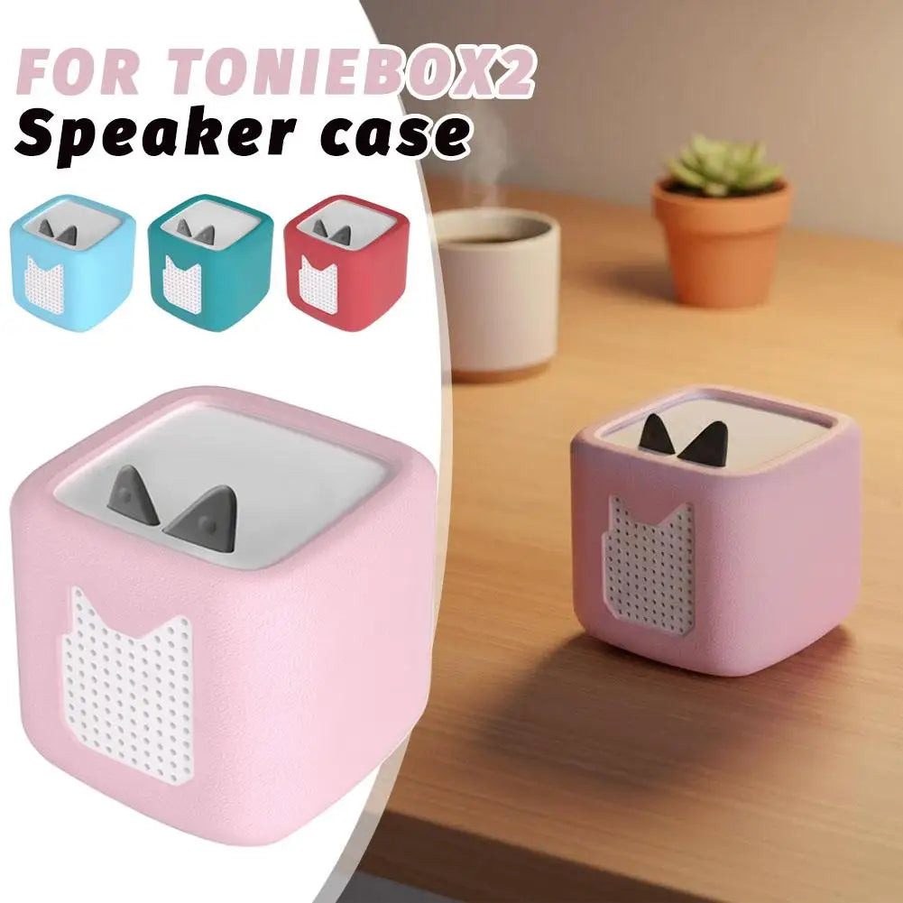 Pink silicone protective case for a Toniebox 2 speaker with various color options.