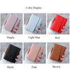 A display of slim triple-fold PU leather wallets in various colors including purple, light blue, red, black, pink, and brown.