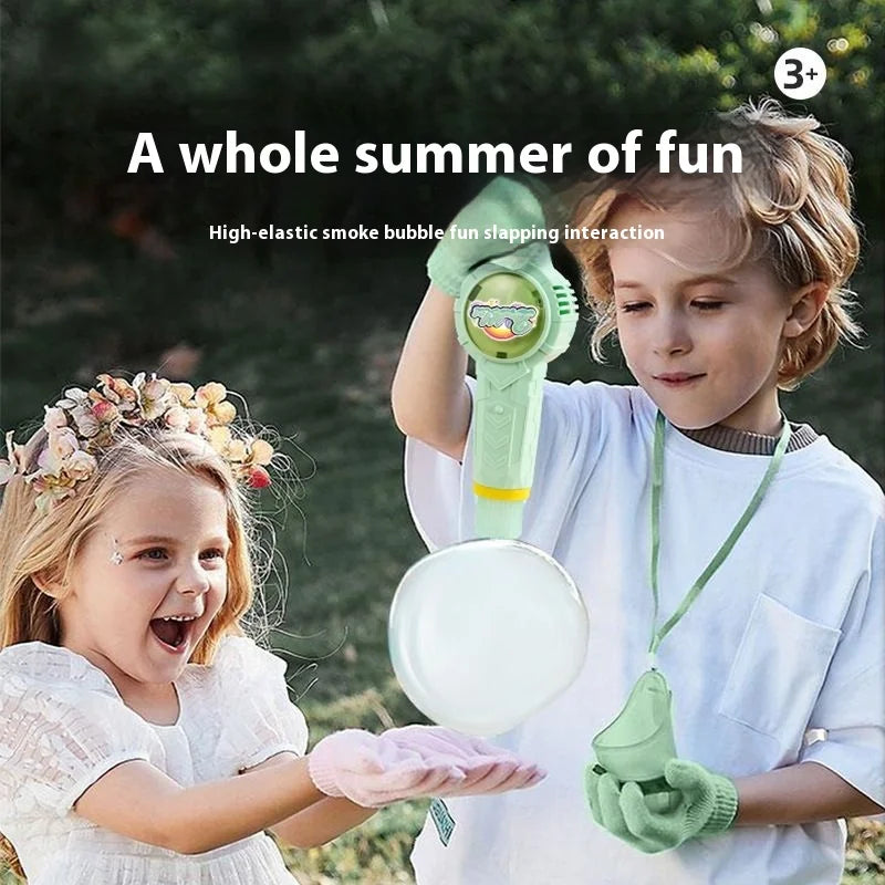 A young boy is playing with a magic smoke bubble machine and a girl is smiling nearby.