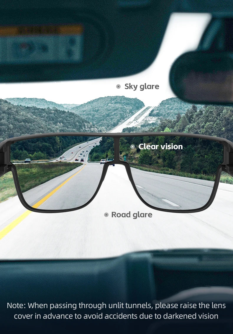 A close-up view of polarized clip-on sunglasses showing glare on the road and sky.