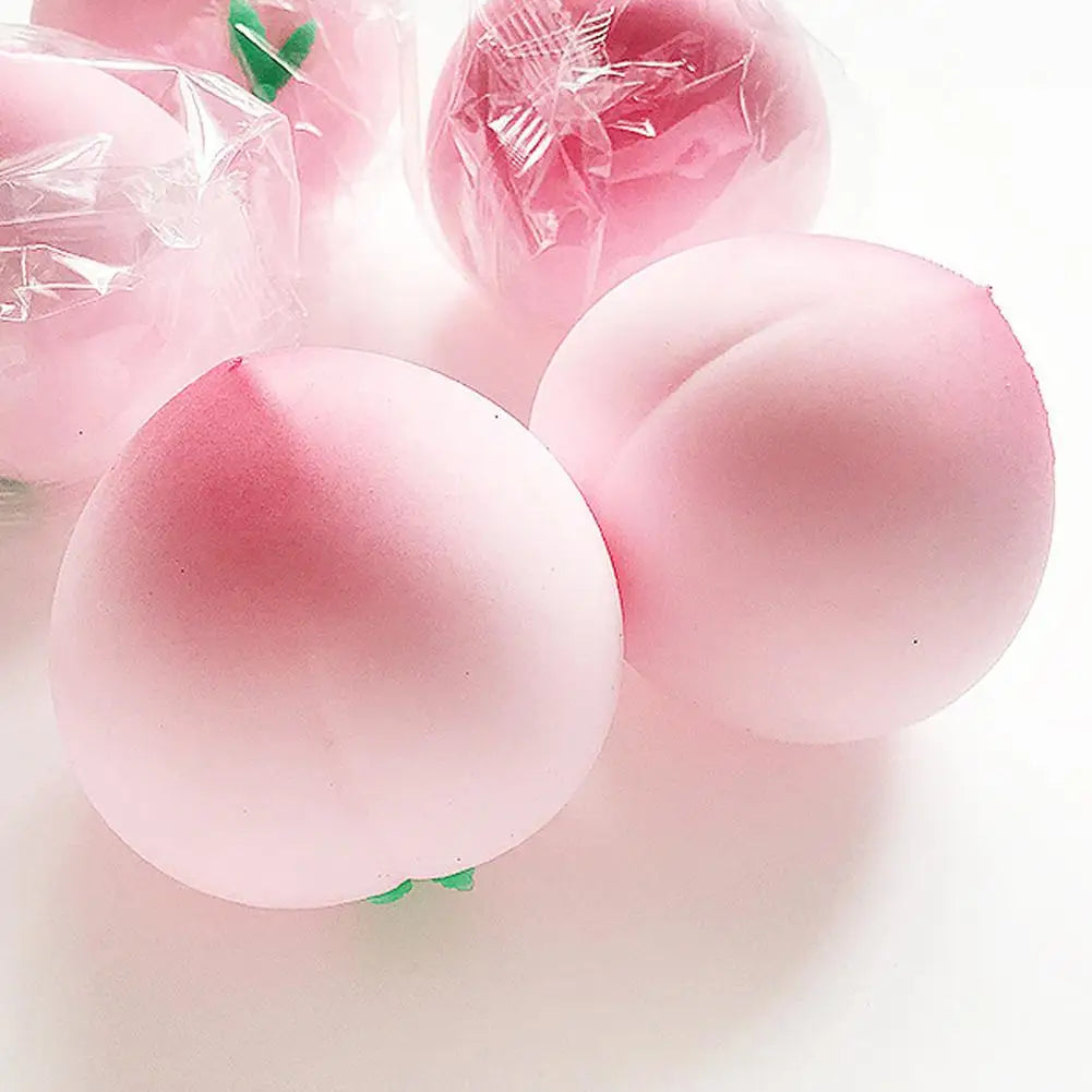 Jouet anti-stress pêche rose moelleux avec emballage en plastique transparent