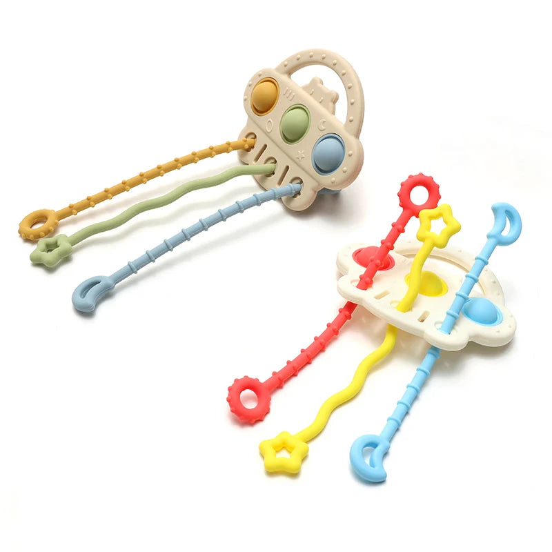 A silicone bear teether toy with a pull string featuring various colored textured grips.