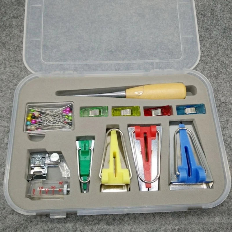 A plastic storage box containing a complete DIY bias tape maker set with various tools and a binder foot.