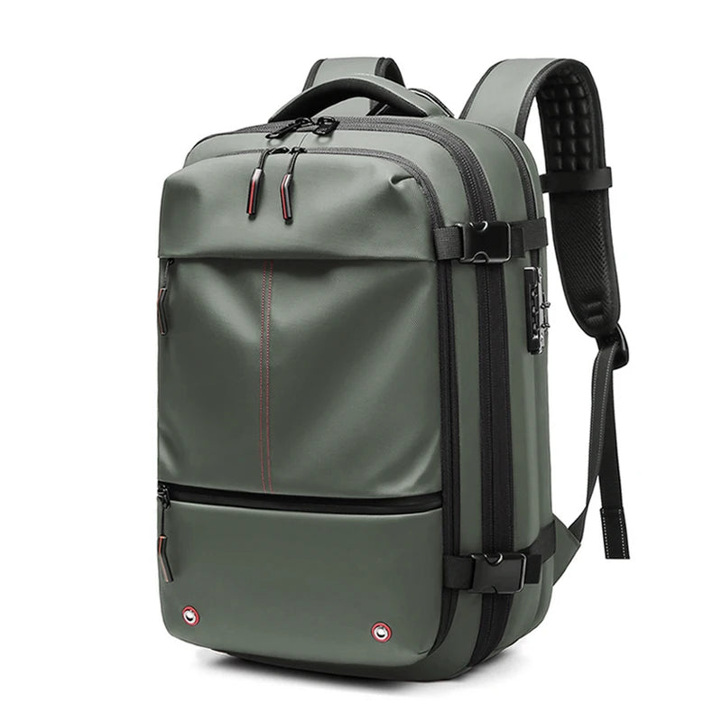 A dark olive green expandable travel laptop backpack with black straps and compression features.