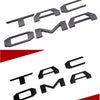 Black 3D letter emblem for Toyota Tacoma tailgate featuring the letters TAC OMA.