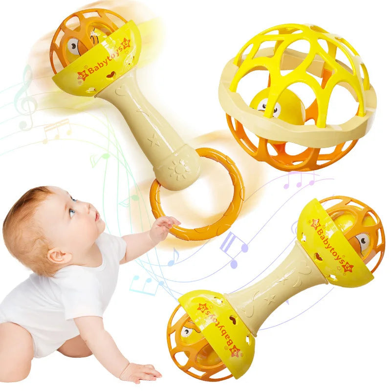 A baby is interacting with a yellow and orange sensory spinning rattle toy set.