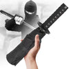 A person in a black hoodie is holding a black katana with a decorative sheath and a folding umbrella blade.
