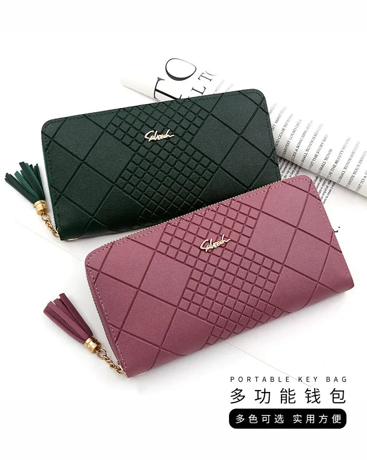 A dark green quilted PU leather wristlet clutch wallet with a gold tassel and a mauve pink version.