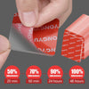 Hand applying a red adhesive pad to a clear sheet, demonstrating the strength of heavy-duty double-sided adhesive pads.