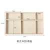 A light beige velvet jewelry organizer tray with six detachable compartments.