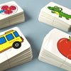 A collection of puzzle cards featuring animals like a frog and a school bus, and fruit like a tomato.
