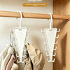 V-shaped double-sided clothes hanger storage rack with 12 hooks mounted on a wooden rod.