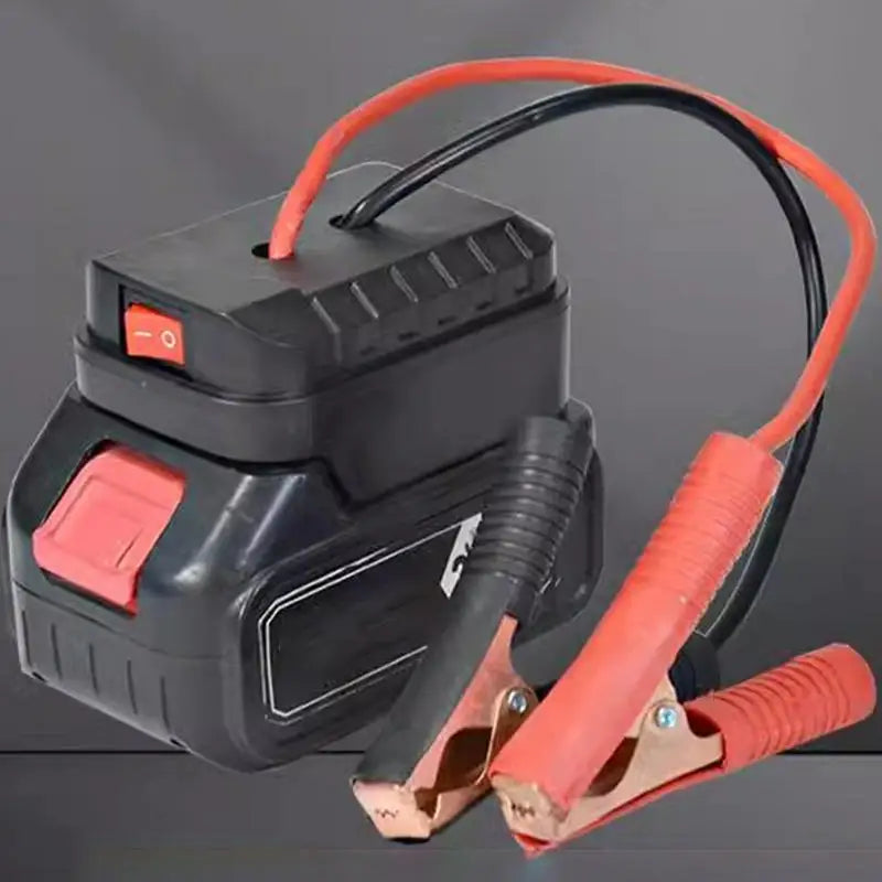Démarrage de voiture portable noir et orange avec câble flexible et pince visible.