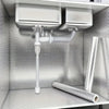 A close-up view of a self-adhesive aluminum foil wallpaper liner installed as a kitchen backsplash in a cabinet.