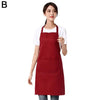 A woman wearing a maroon waterproof apron with a front pocket.
