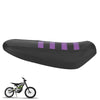Black protective PVC motorcycle seat cover with purple stripes shown next to a dirt bike.