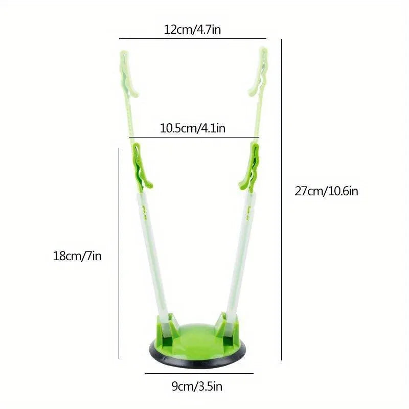 A green adjustable bag holder rack with a flat base and hanging arms for kitchen storage.