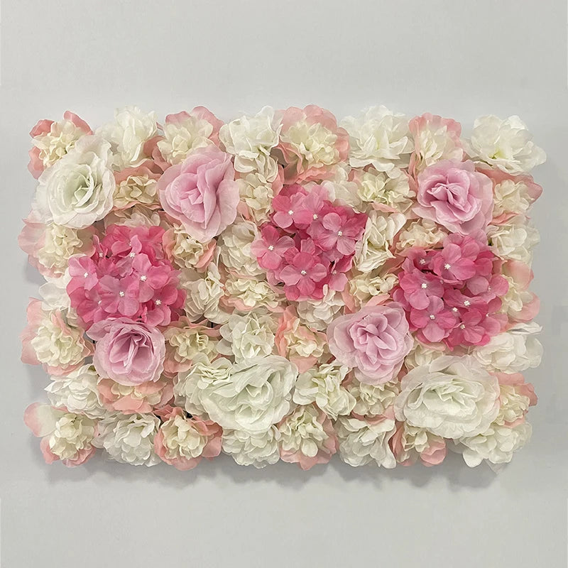 A wall panel composed of pink and white silk rose flowers for weddings and events.