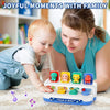 A woman is interacting with a toddler using a Peek-a-Boo dinosaur toy for sensory learning.